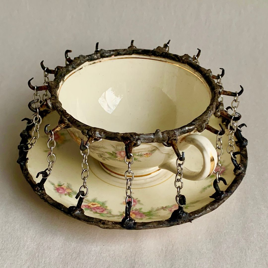 Glen Taylor's Unique Art: A Fusion of Human Nature and Kintsugi a necklace on a table