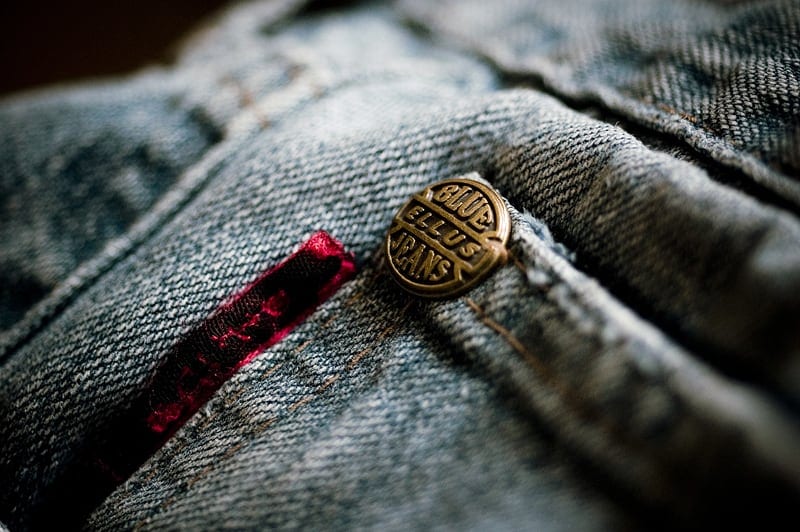 Closeup of copper rivet on jeans